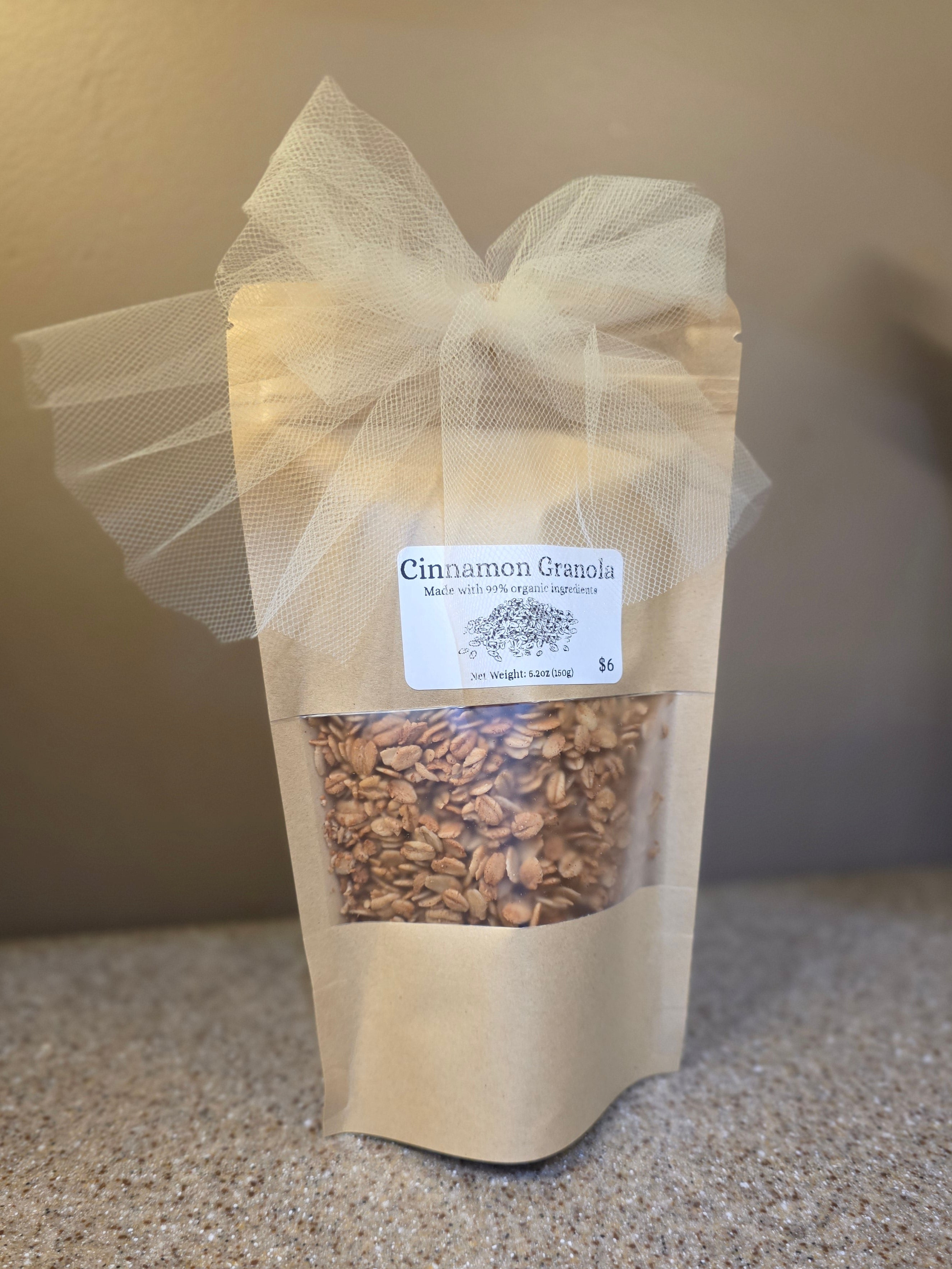 Bag of cinnamon granola on a stone surface